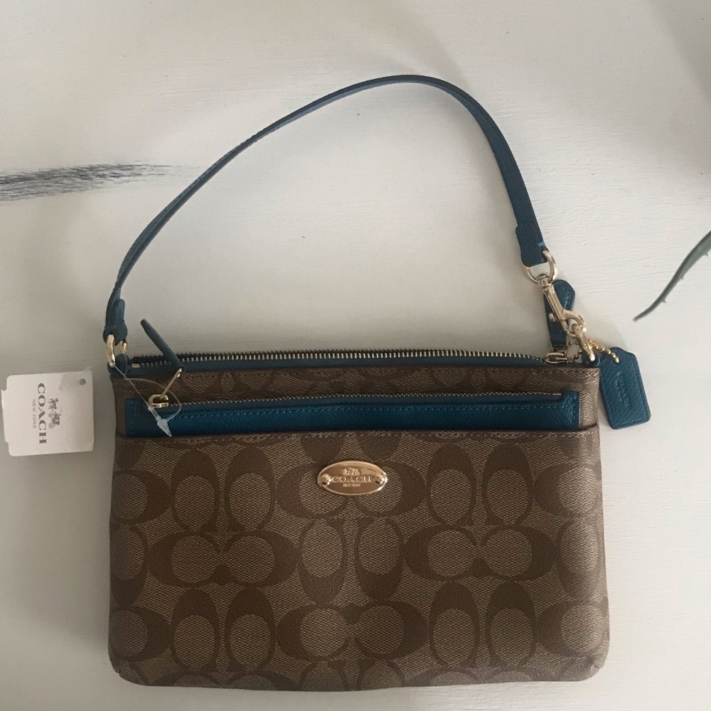 Coach purse with zipper insert.  Never been used!